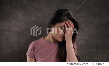 Young Asian woman suffers from depression 89340749