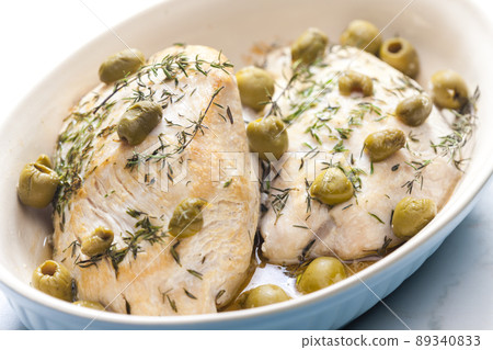 turkey breast baked with green olives and tyme turkey breast baked with green olives and tyme 89340833