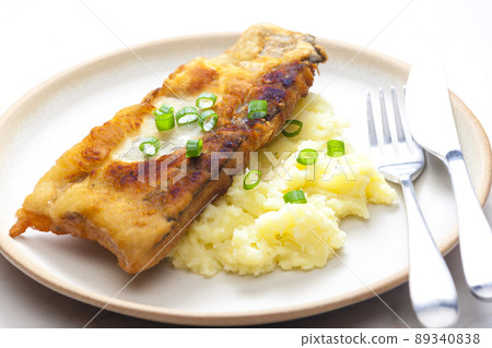fried fish with mashed potatoes and spring onion fried fish with mashed potatoes and spring onion 89340838