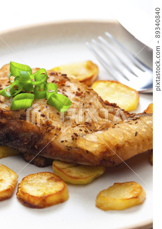 carp on cumin with fried potatoes carp on cumin with fried potatoes 89340840