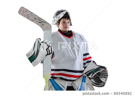 Half-length portrait of boy, child, hockey player in uniform of goalkeeper posing isolated over white studio backgrund Half-length portrait of boy, child, hockey player in uniform of goalkeeper posing isolated over white studio backgrund 89340892