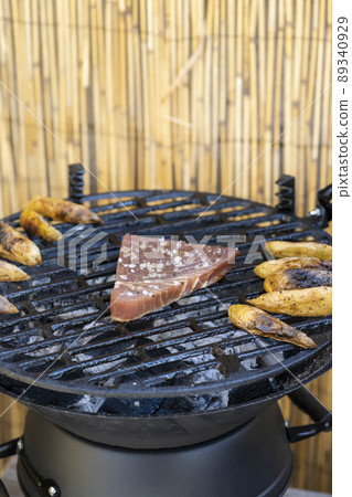 grilled tuna steak with baked potatoes 89340929