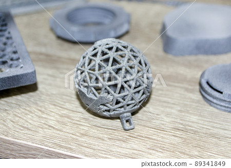 Many models printed on 3D printer. Gray and black objects printed on 3D printer 89341849