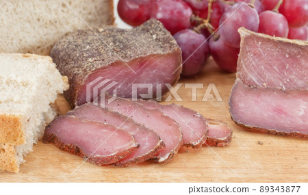 Sliced cured at home pork and spices with cumin Sliced cured at home pork and spices with cumin 89343877