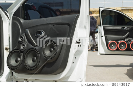 car with a large number of installed audio speakers and subwoofer car with a large number of installed audio speakers and subwoofer 89343917