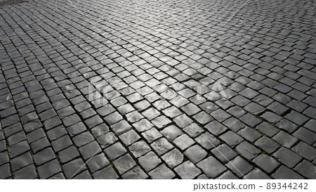 Close-up of cobblestone street in Rome, Italy. Close-up of cobblestone street in Rome, Italy. 89344242