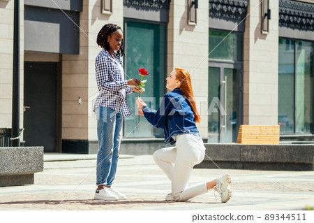 caucasian redhaired ginger woman ask her brazilian girlfriend to be her wife caucasian redhaired ginger woman ask her brazilian girlfriend to be her wife 89344511