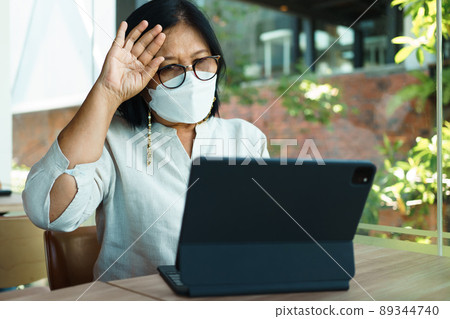 senior woman aged 60-69 years using tablet, watching lesson Sign language online course communicate by conference video call from home, e-learning education concept senior woman aged 60-69 years using tablet, watching lesson Sign language online course communicate by conference video call from home, e-learning education concept 89344740