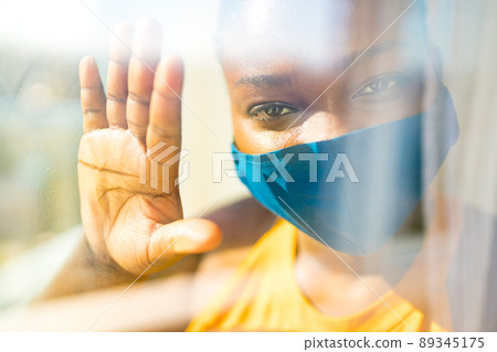 african american woman feeling alone at her home looking to outdoors from her apartment balcony african american woman feeling alone at her home looking to outdoors from her apartment balcony 89345175