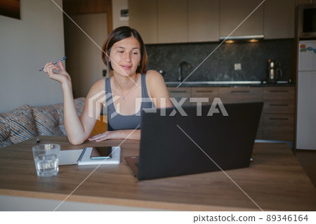 young asian woman at home, remote work 89346164