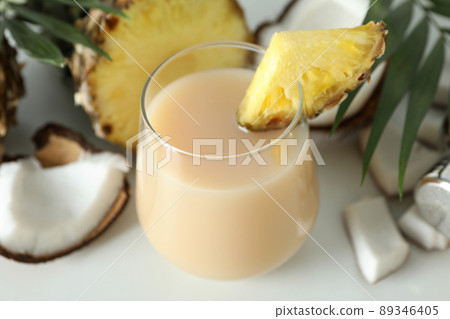 Pina colada cocktail and ingredients on white background 89346405