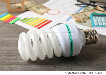 Energy saving concept on gray textured background 89346696