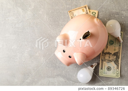 Energy saving concept on gray textured background 89346726