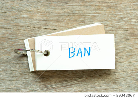 Flash card with handwriting word ban on wood background 89348067
