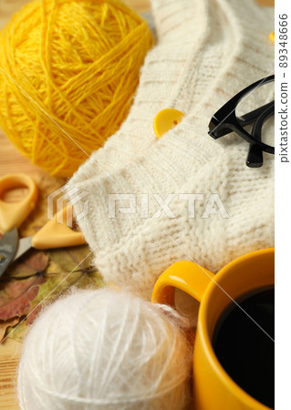 Concept of knitting with yarn balls on wooden table, close up 89348666