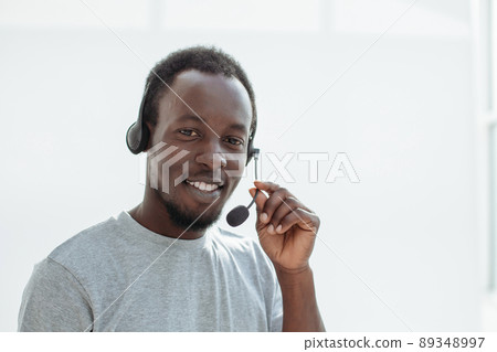 close up. a handsome young man with a headset. close up. a handsome young man with a headset. 89348997