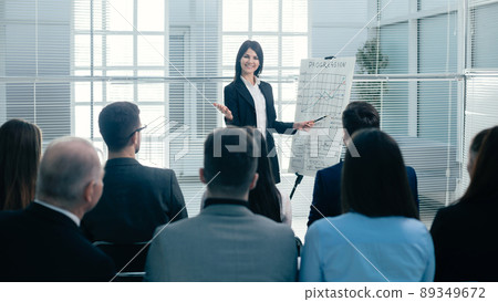 businesswoman making a presentation for the employees of the company businesswoman making a presentation for the employees of the company 89349672