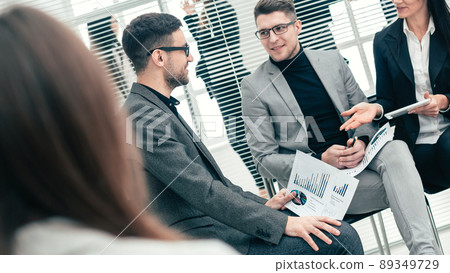 business colleagues discussing financial data in a conference room business colleagues discussing financial data in a conference room 89349729