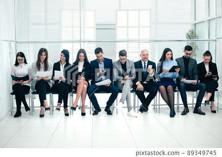 group of business people use their gadgets before starting a business meeting 89349745