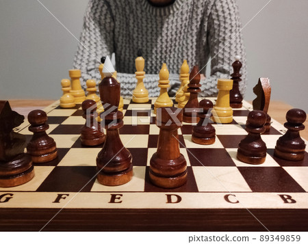 Man analyzing chess game on chess board - strategic concept. Man analyzing chess game on chess board - strategic concept. 89349859