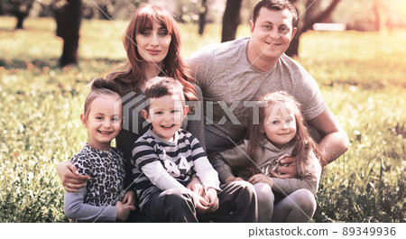 Friendly, cheerful family of five smiling and looking at the camera 89349936