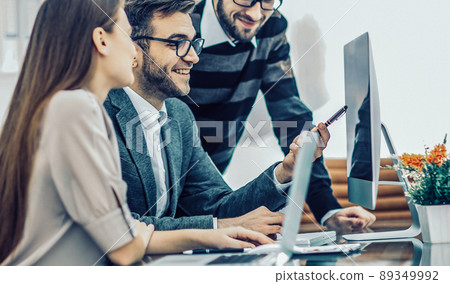 professional business team is developing a new project ,sitting professional business team is developing a new project ,sitting 89349992
