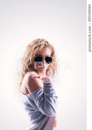 portrait of beautiful blonde girl in dark glasses with curly hai portrait of beautiful blonde girl in dark glasses with curly hai 89349994
