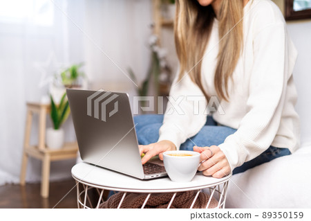 Woman with laptop at home Woman with laptop at home 89350159