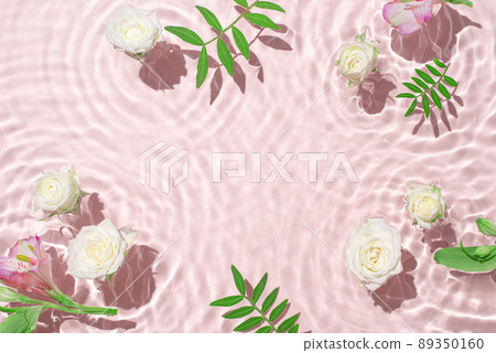 Sunny summer cosmetic background with flowers. The texture of the water surface. Sunny summer cosmetic background with flowers. The texture of the water surface. 89350160