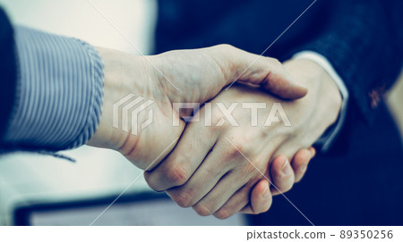 concept of partnership in business: a handshake of business part concept of partnership in business: a handshake of business part 89350256