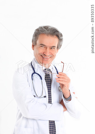 portrait of a benevolent physician therapist.isolated on white background portrait of a benevolent physician therapist.isolated on white background 89350335