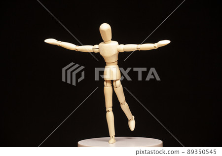 image of wooden figure dark background  89350545