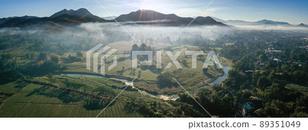 Aerial view of Pai rice fields during sunrise with fog in Mae Hong Son, Thailand Aerial view of Pai rice fields during sunrise with fog in Mae Hong Son, Thailand 89351049