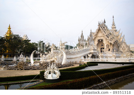 Aerial view of Wat Rong Khun, the white temple, at sunrise, in Chiang Rai, Thailand Aerial view of Wat Rong Khun, the white temple, at sunrise, in Chiang Rai, Thailand 89351318