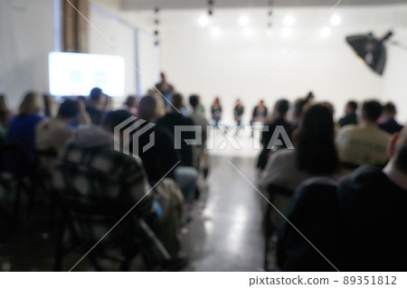 Blurred background of the business conference, a group of people on the stage, presentation of the project, public talk. High quality photo Blurred background of the business conference, a group of people on the stage, presentation of the project, public talk. High quality photo 89351812