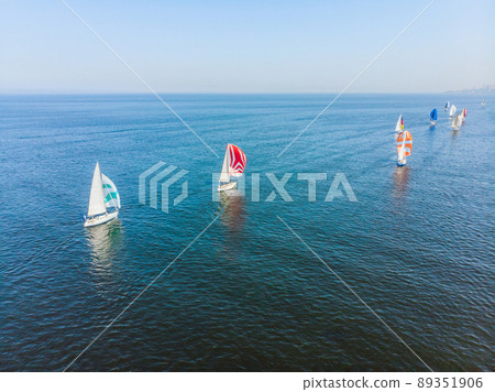 Sailboat shot from above showing the clear blue water of the ocean 89351906