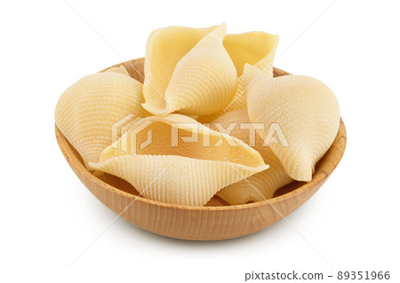Conchiglioni italian pasta in wooden bowl isolated on white background with clipping path and full depth of field Conchiglioni italian pasta in wooden bowl isolated on white background with clipping path and full depth of field 89351966