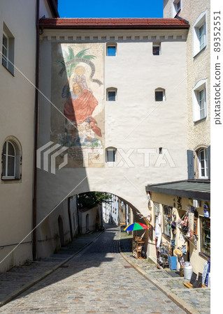 Germany, Passau, Rue de Passau with an arch and a mural. 89352551
