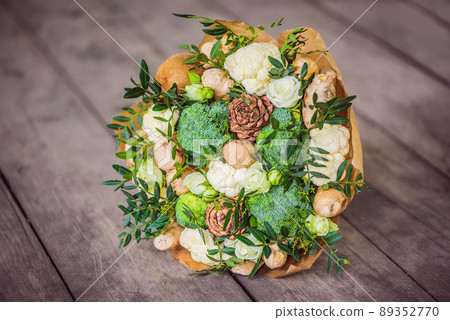 Bouquet of vegetables and fruits, useful gift for a healthy lifestyle, a detox diet. broccoli, cauliflower, ginger, cedar cone Bouquet of vegetables and fruits, useful gift for a healthy lifestyle, a detox diet. broccoli, cauliflower, ginger, cedar cone 89352770