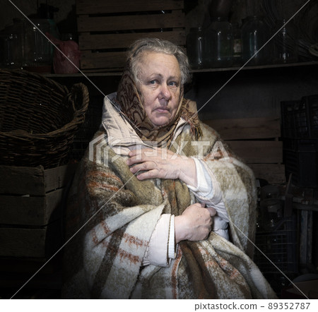 Frightened woman hide from explosions in the basement. During the sirens due to the shelling of Kyiv. Ukraine. 26 February 2022 Frightened woman hide from explosions in the basement. During the sirens due to the shelling of Kyiv. Ukraine. 26 February 2022 89352787
