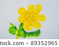 Yellow flower with green leaves. Multi-colored children drawing 89352965