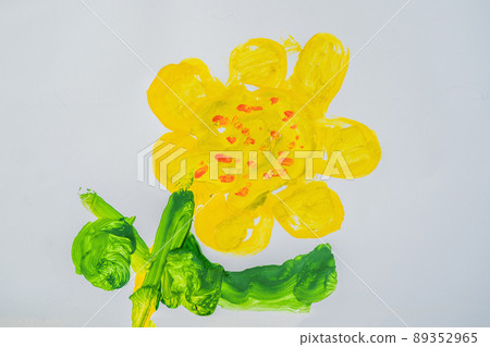 Yellow flower with green leaves. Multi-colored children drawing Yellow flower with green leaves. Multi-colored children drawing 89352965