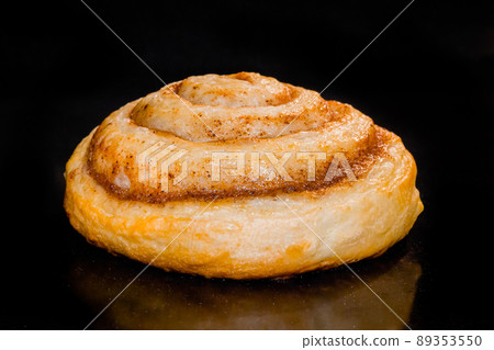 One homemade cinnamon bun baking and rising in electric oven - close up One homemade cinnamon bun baking and rising in electric oven - close up 89353550