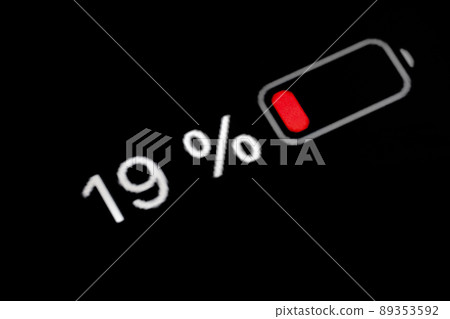 Smartphone charged battery level indicator - nineteen percent: close up macro 89353592