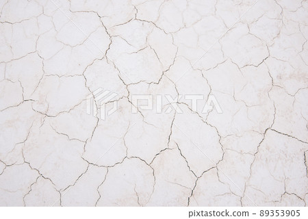 Damaged sandy white surface texture with cracks 89353905