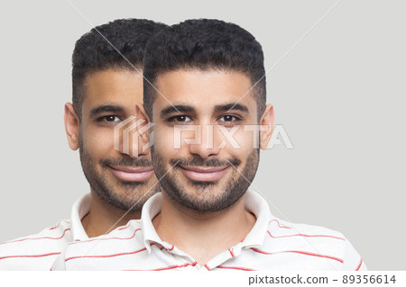 Closeup portrait of young brunette bearded man with different facial skin tone, darker and lighter, looking and smiling. before and after, sunbath, treatment and solarium concept. indoor studio shot. Closeup portrait of young brunette bearded man with different facial skin tone, darker and lighter, looking and smiling. before and after, sunbath, treatment and solarium concept. indoor studio shot. 89356614