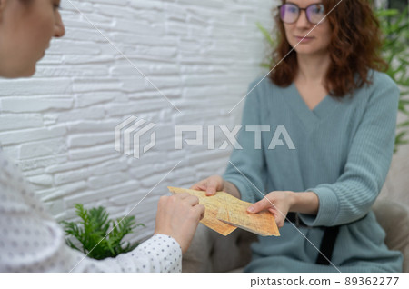 Psychologist uses metaphorical associative cards in a session with a patient. Psychologist uses metaphorical associative cards in a session with a patient. 89362277
