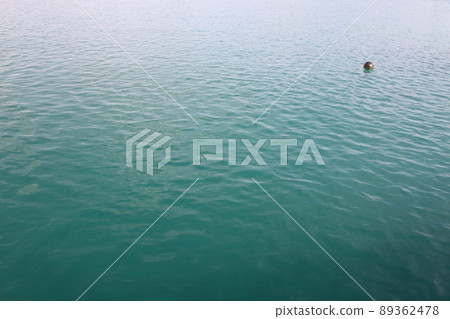 Black buoy floating in the sea Black buoy floating in the sea 89362478