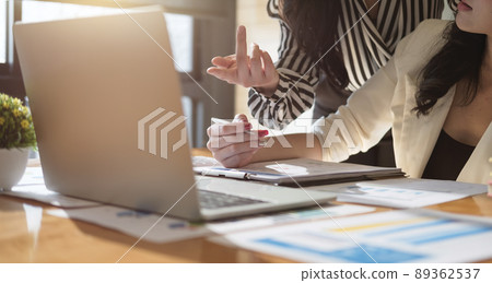 Business Team analyzing financial document on workplace - Corporate Organization Meeting Concept 89362537