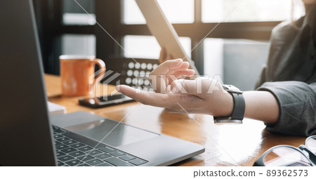 Young woman use tablet computer for business analyze and hand potinting on computer Young woman use tablet computer for business analyze and hand potinting on computer 89362573